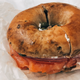 Image for article titled Jezebel Reviews: Cynthia Nixon's Highly Controversial Cinnamon Raisin Bagel With Lox and Capers